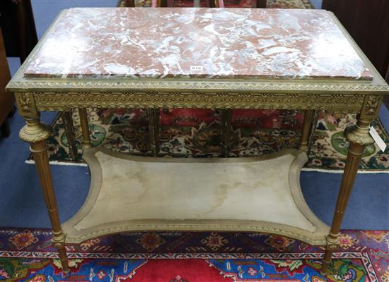 A mid 19th century French carved giltwood marble topped two tier table, W.96cm